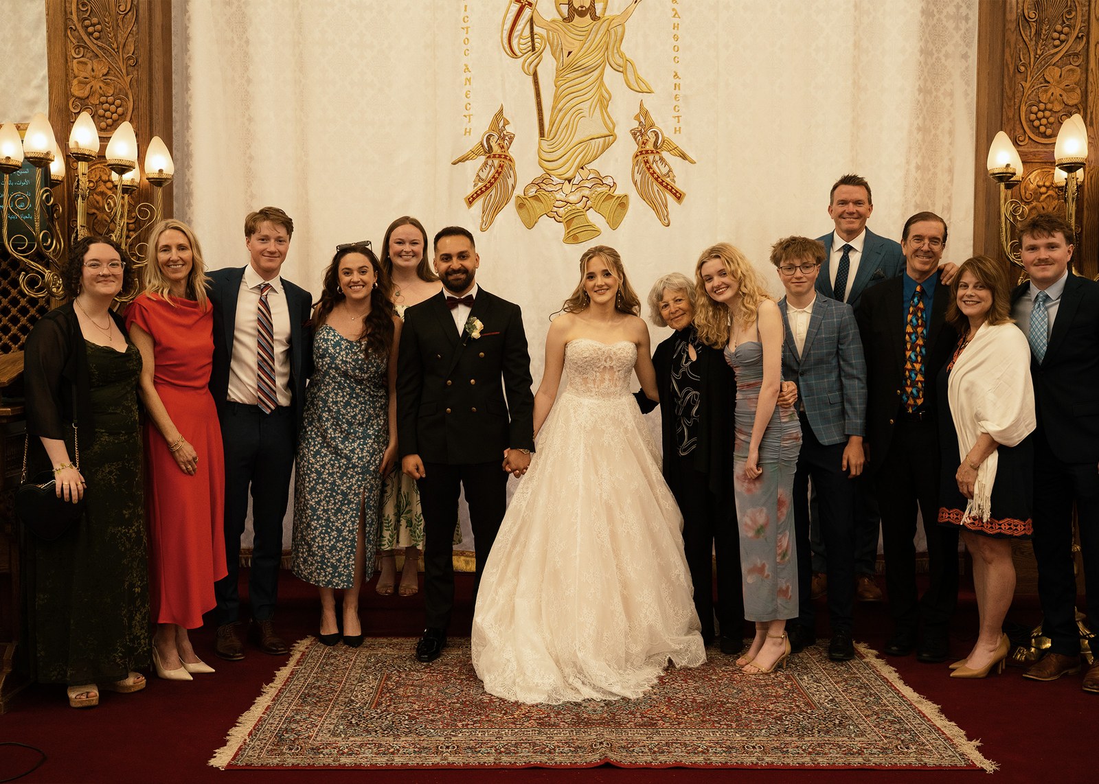 Family group portrait indoors at a formal event