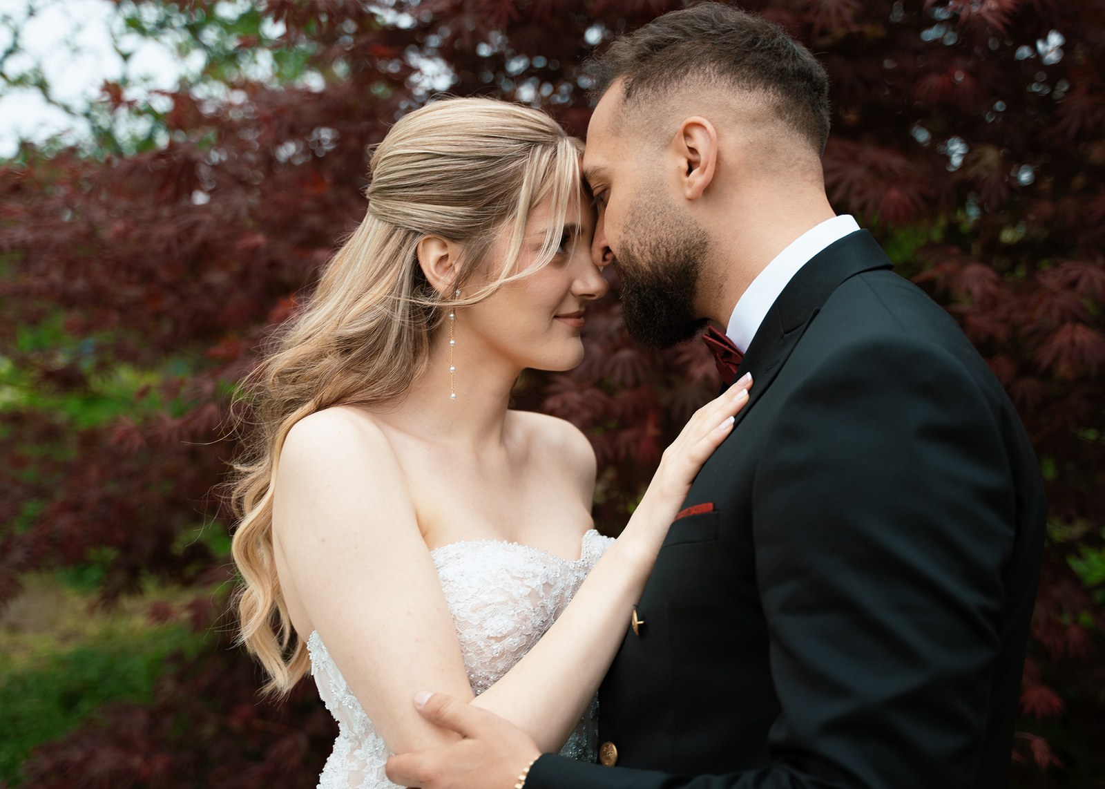 Couple sharing a close, tender moment together outdoors