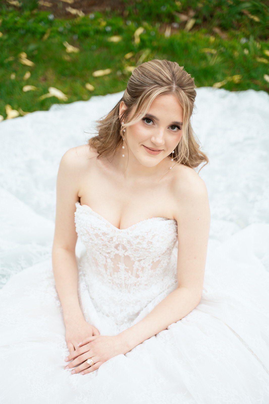 Bridal portrait on a white gown train