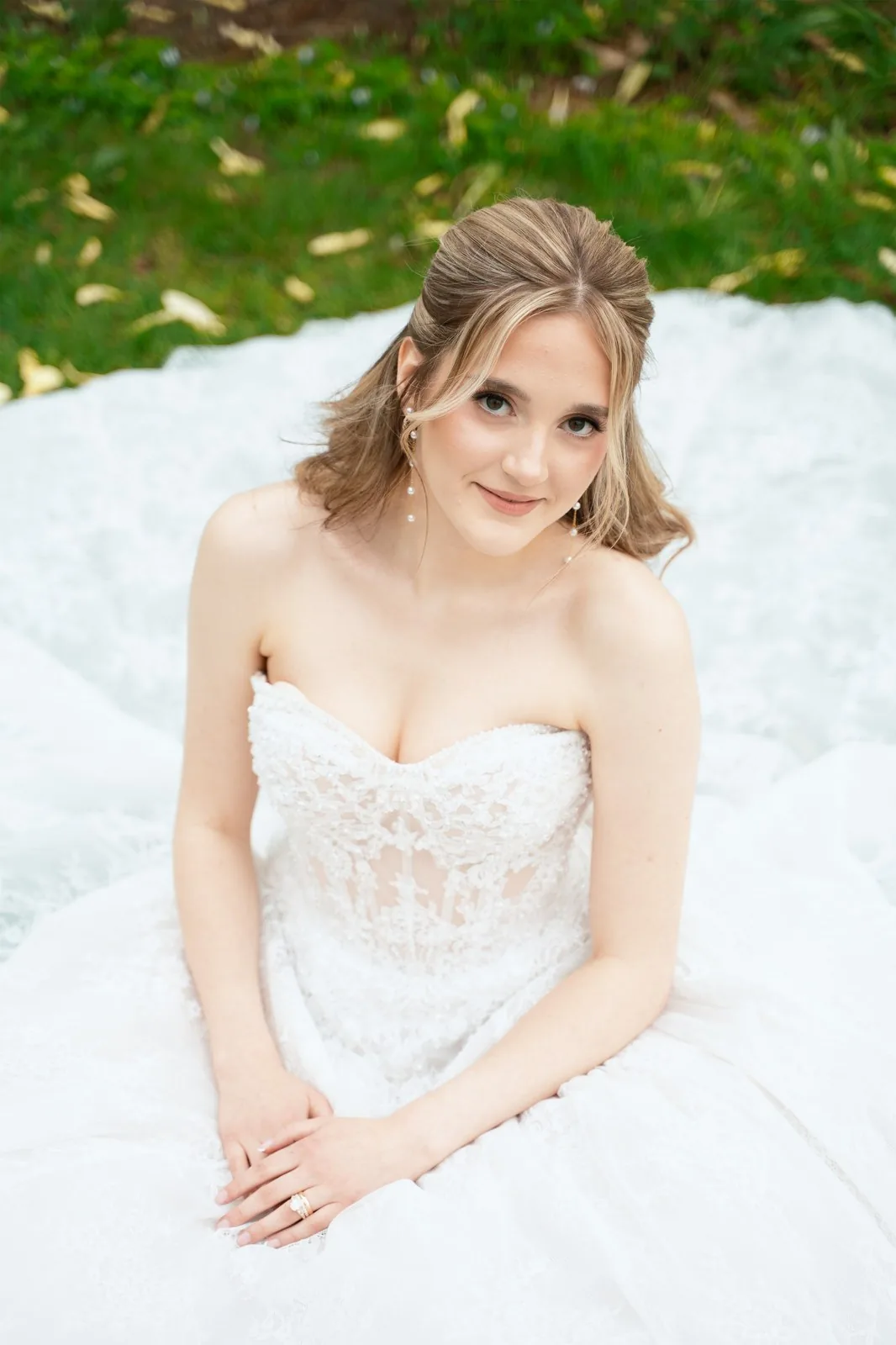 Bridal portrait on a white gown train