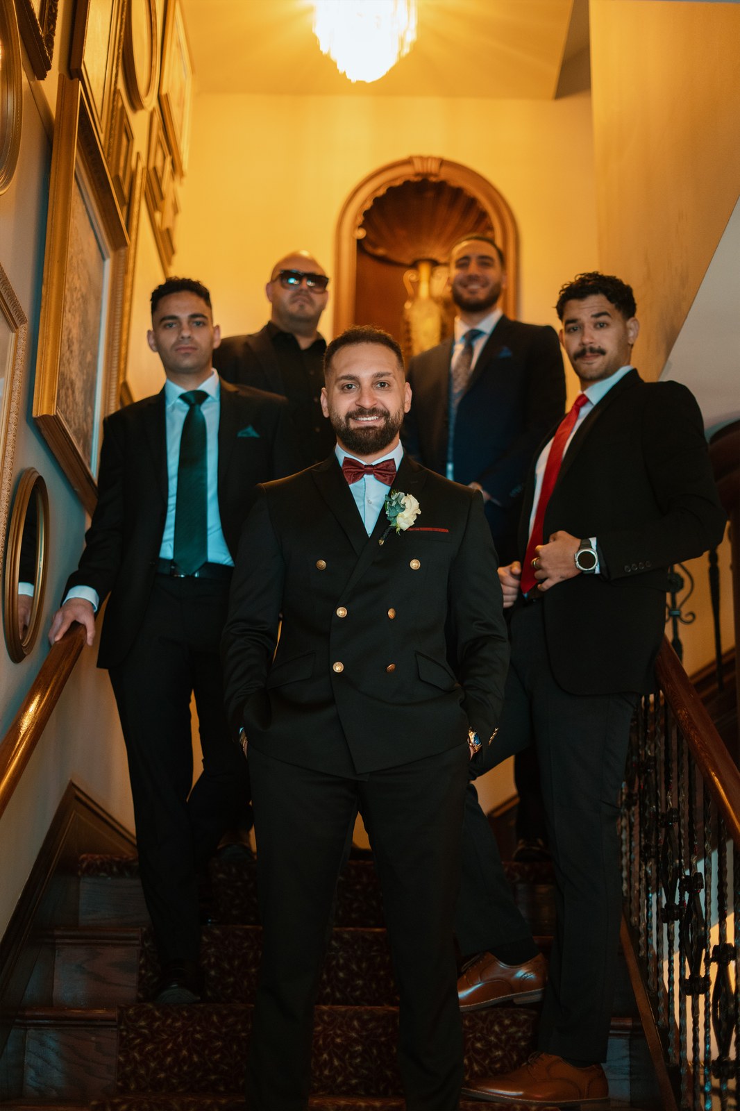 Wedding party descending a grand staircase at an Ottawa wedding venue