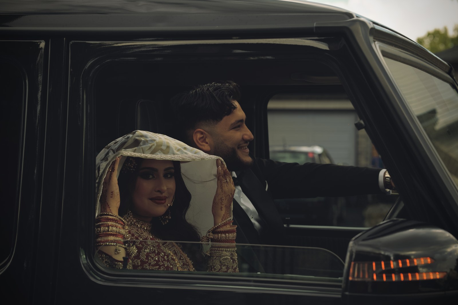 Bride looking out a car window, cinematic wedding videography in Ottawa