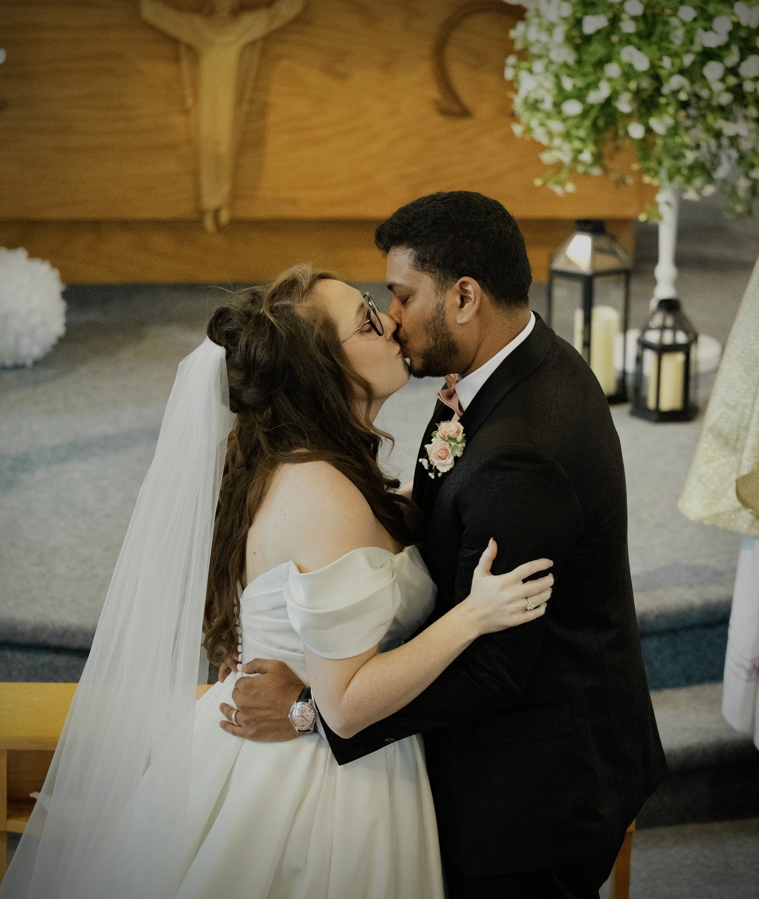 Bride and groom's first kiss at the altar