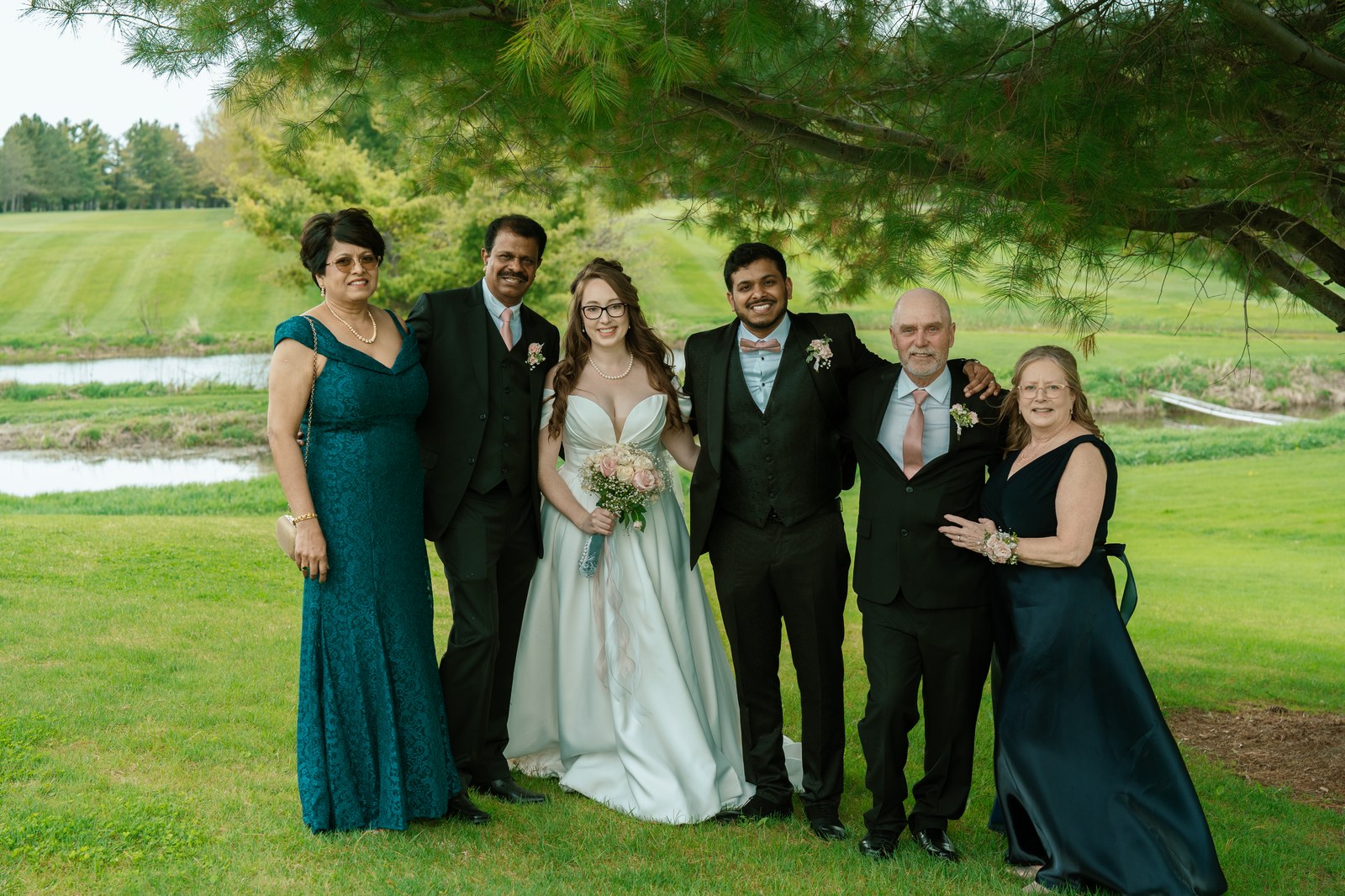 Large family group gathered together outdoors for a celebration