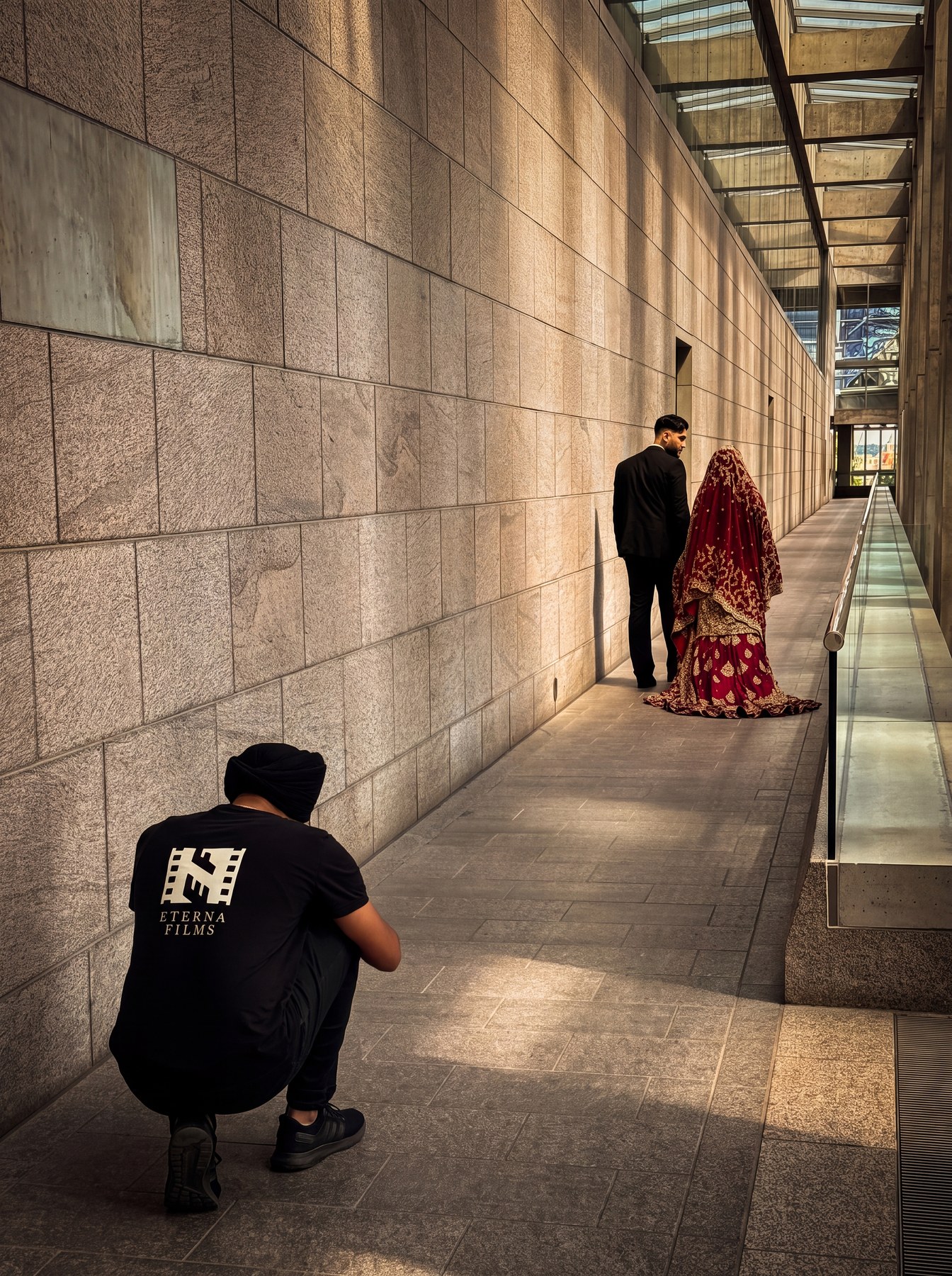 Eterna Films crew member photographing a bride and groom